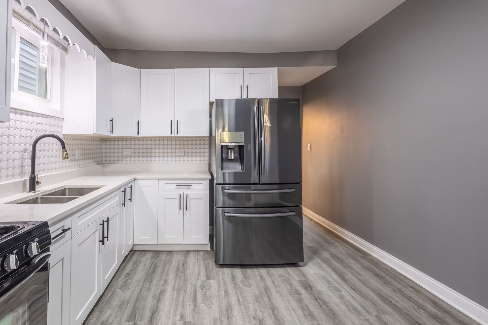 6830 South Honore Street Chicago, IL 60636 - Photo 23 of 31 a kitchen with a refrigerator sink and cabinets