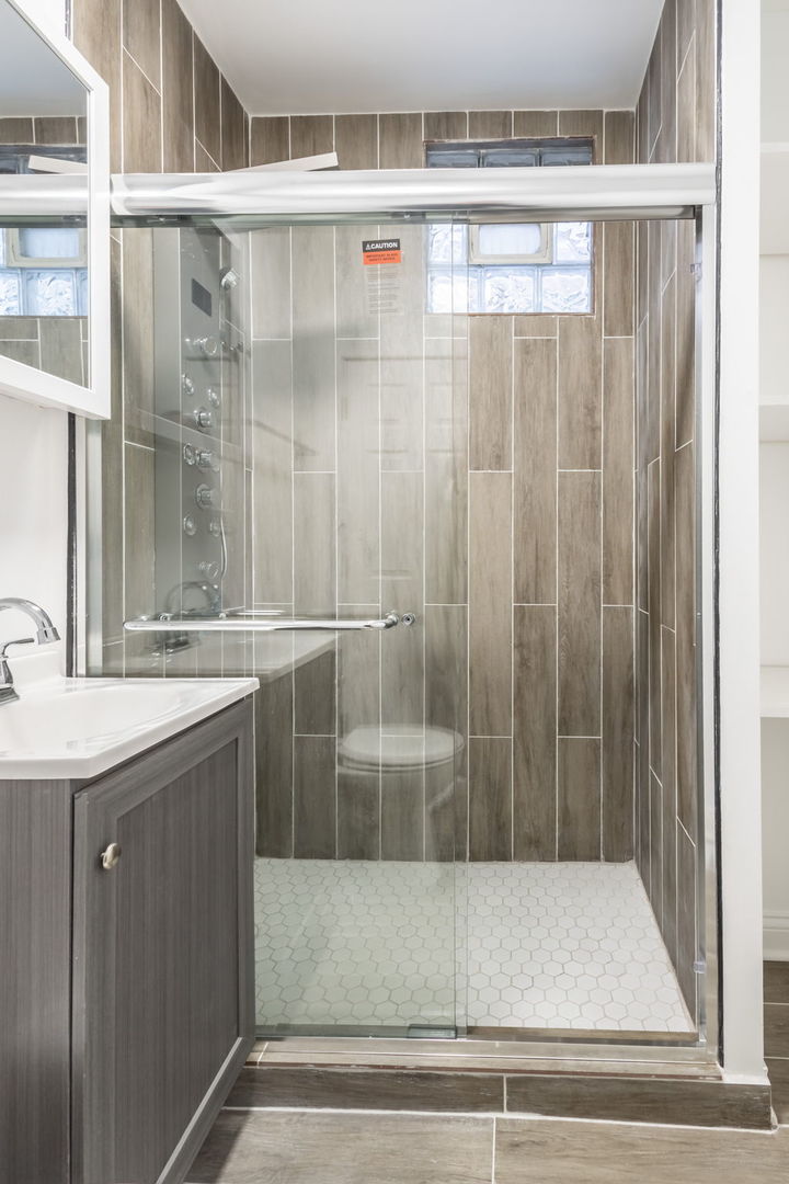 6830 South Honore Street Chicago, IL 60636 - Photo 26 of 31 a bathroom with a shower and a sink