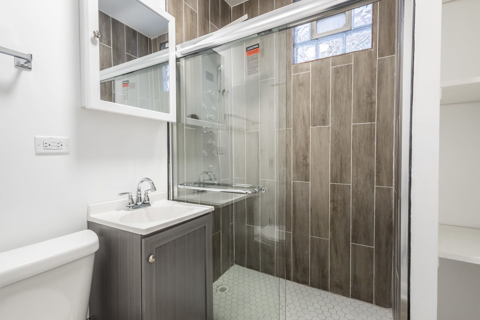 6830 South Honore Street Chicago, IL 60636 - Photo 27 of 31 a bathroom with a sink a toilet and shower