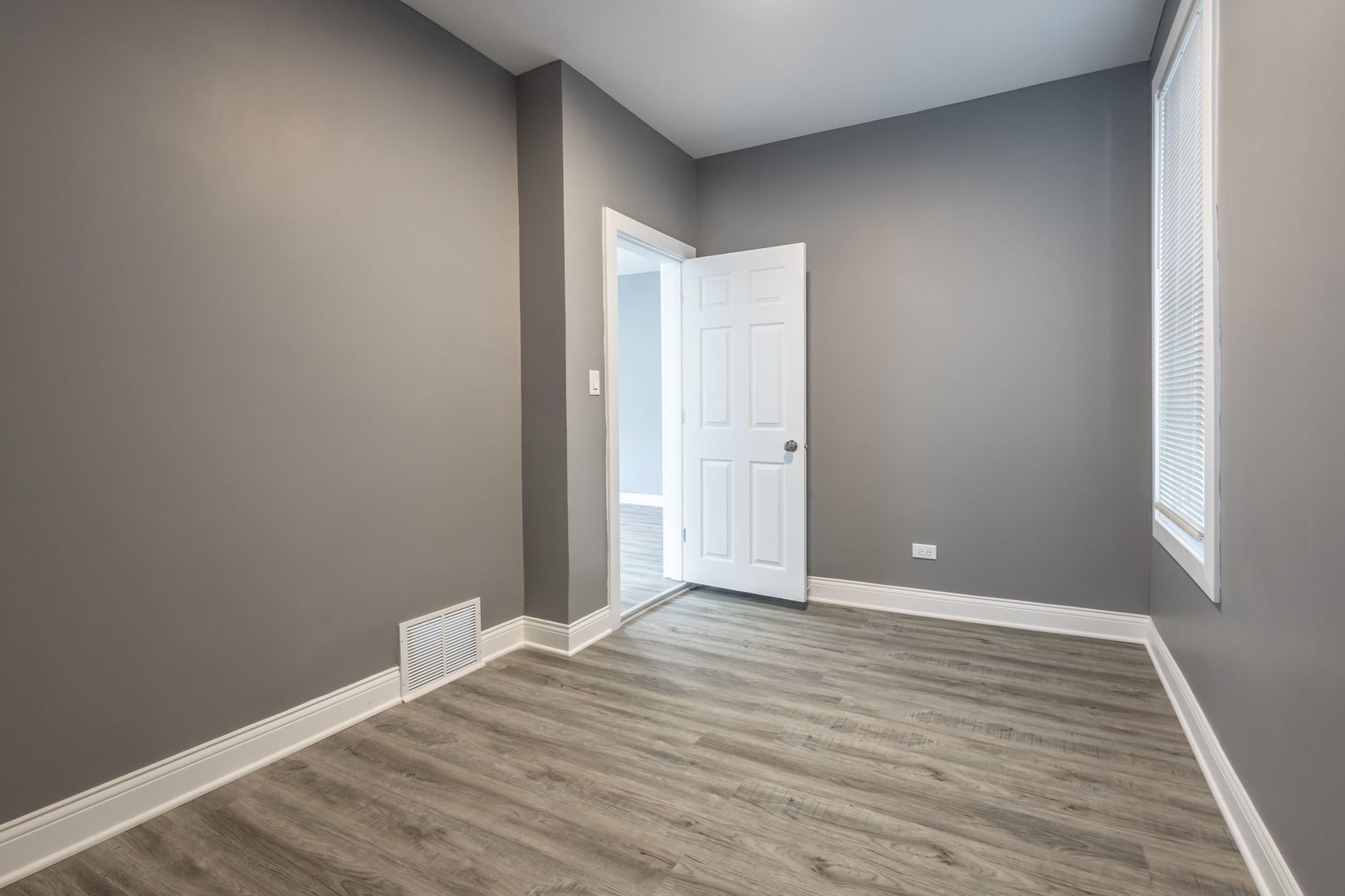 6830 South Honore Street Chicago, IL 60636 - Photo 28 of 31 a view of an empty room with wooden floor