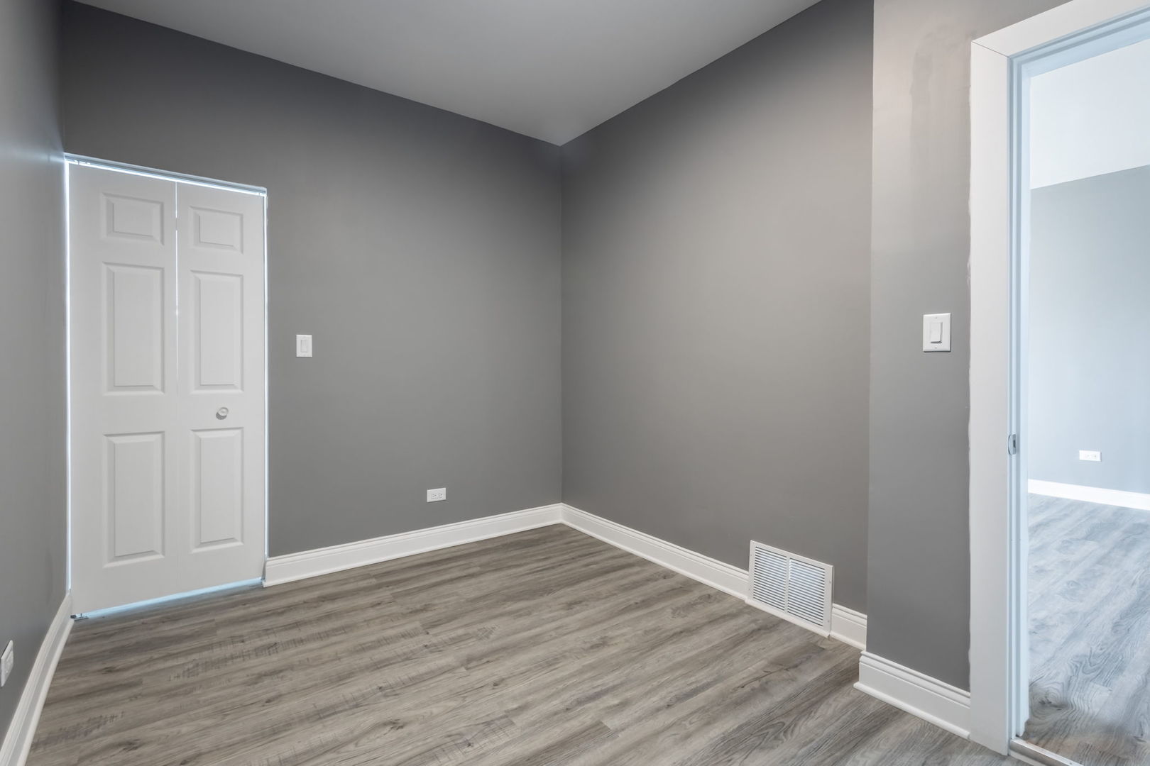 6830 South Honore Street Chicago, IL 60636 - Photo 29 of 31 a view of an empty room with wooden floor