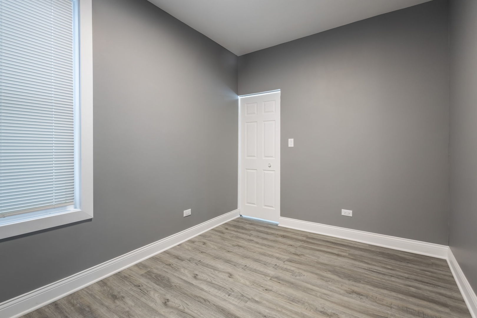 6830 South Honore Street Chicago, IL 60636 - Photo 6 of 31 a view of an empty room with wooden floor