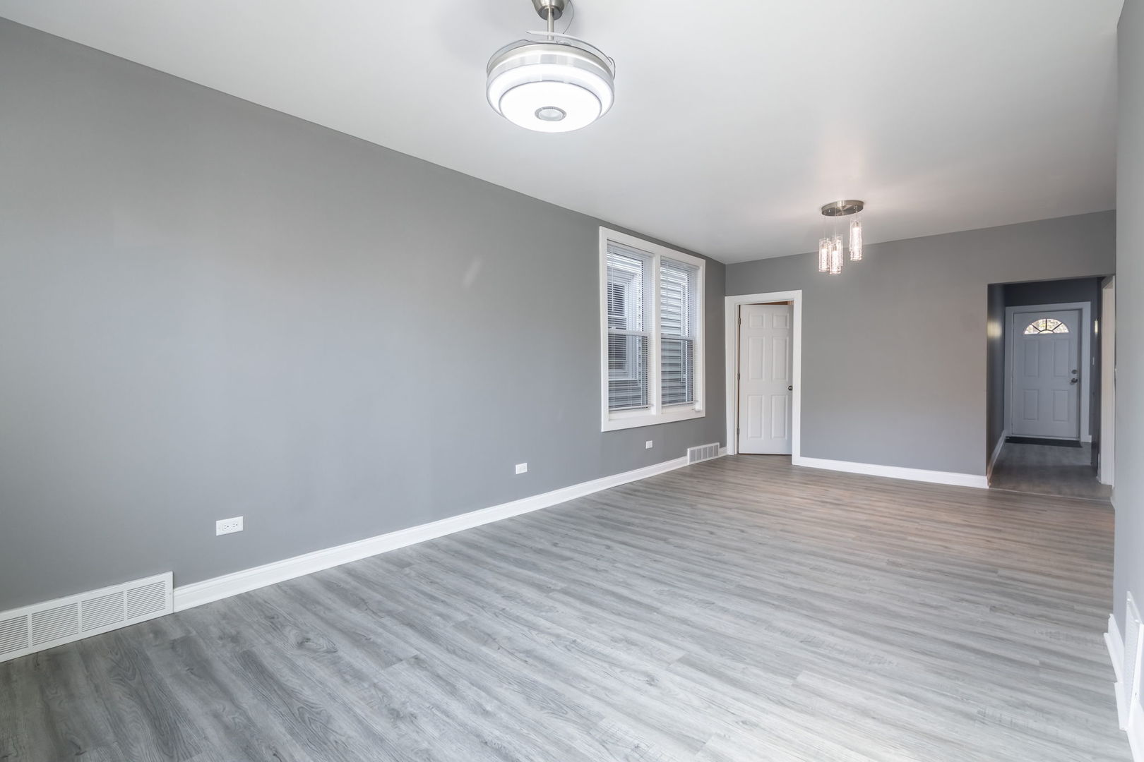 6830 South Honore Street Chicago, IL 60636 - Photo 7 of 31 wooden floor in an empty room with a window