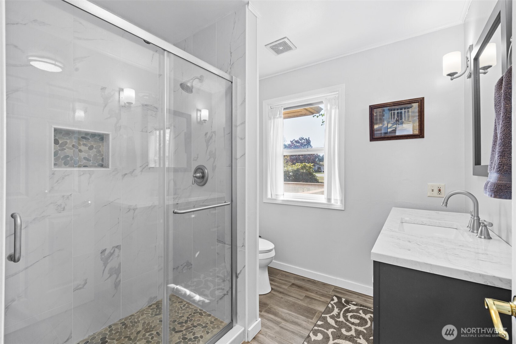 1330 Thornton Drive Sequim, WA 98382 - Photo 20 of 39 a bathroom with a granite countertop sink mirror and shower