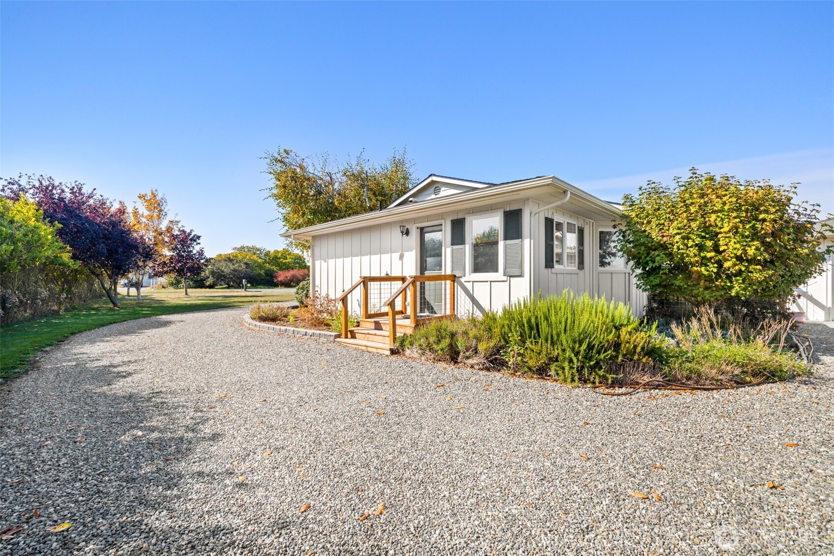 1330 Thornton Drive Sequim, WA 98382 - Photo 34 of 39 a front view of a house with a yard and potted plants
