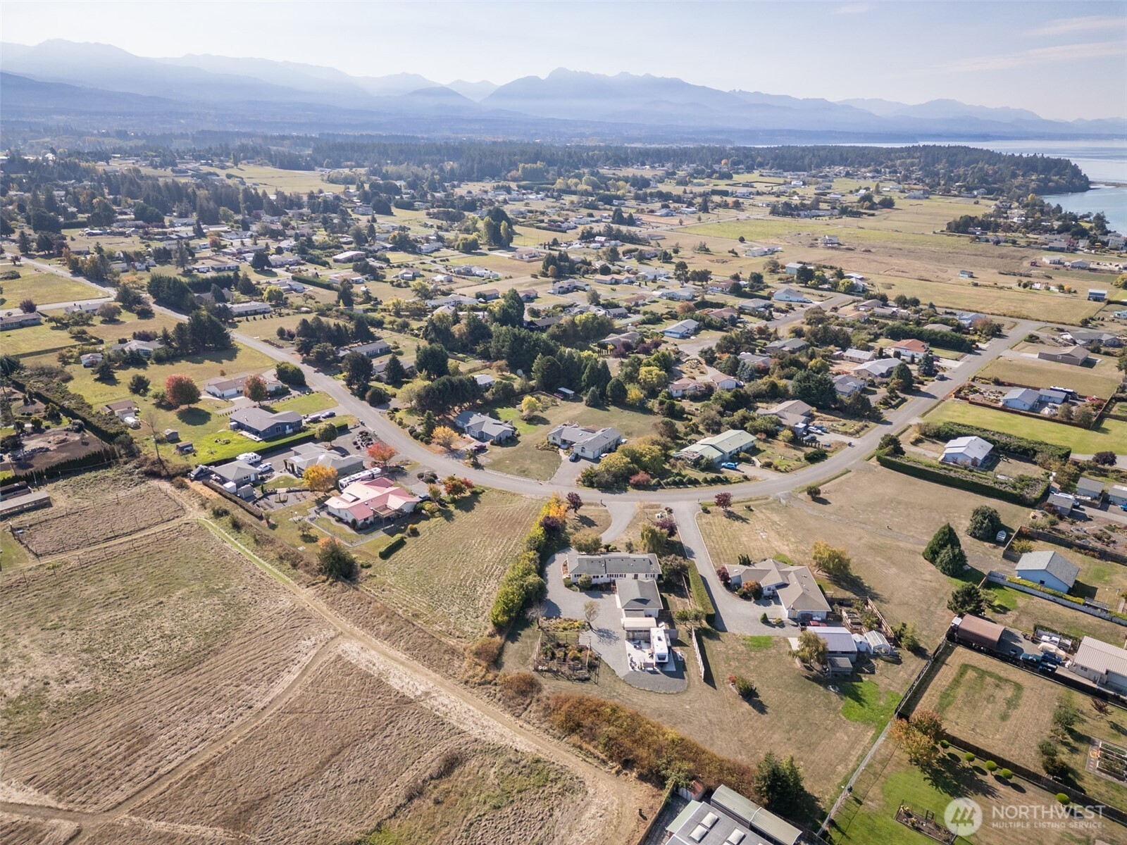 1330 Thornton Drive Sequim, WA 98382 - Photo 5 of 39 an aerial view of a city with lots of residential buildings