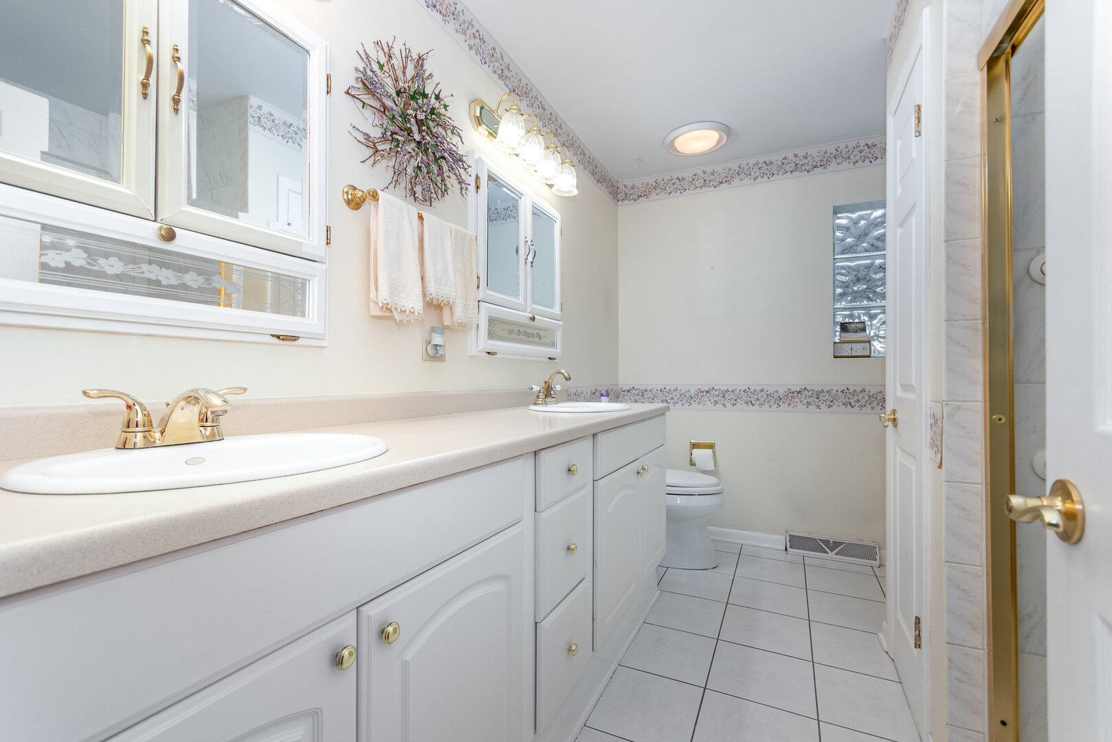 15200 Pine Drive Oak Forest, IL 60452 - Photo 13 of 20 a spacious bathroom with a granite countertop sink a toilet and a mirror
