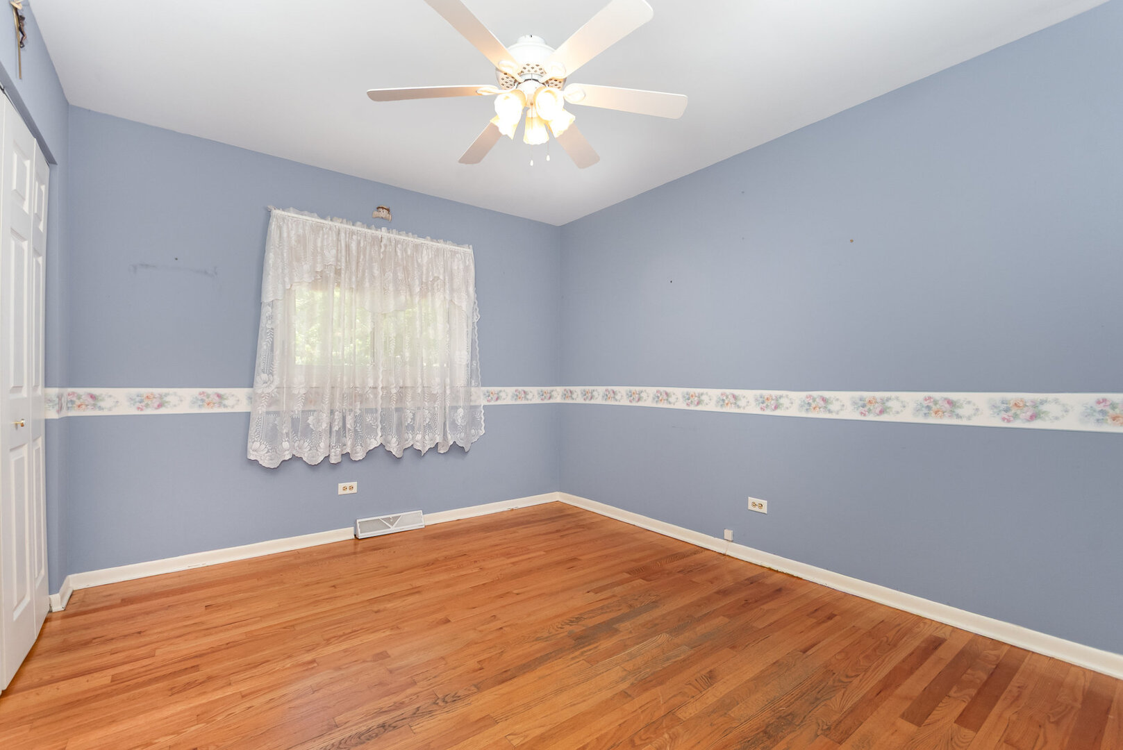 15200 Pine Drive Oak Forest, IL 60452 - Photo 14 of 20 wooden floor in an empty room with a window