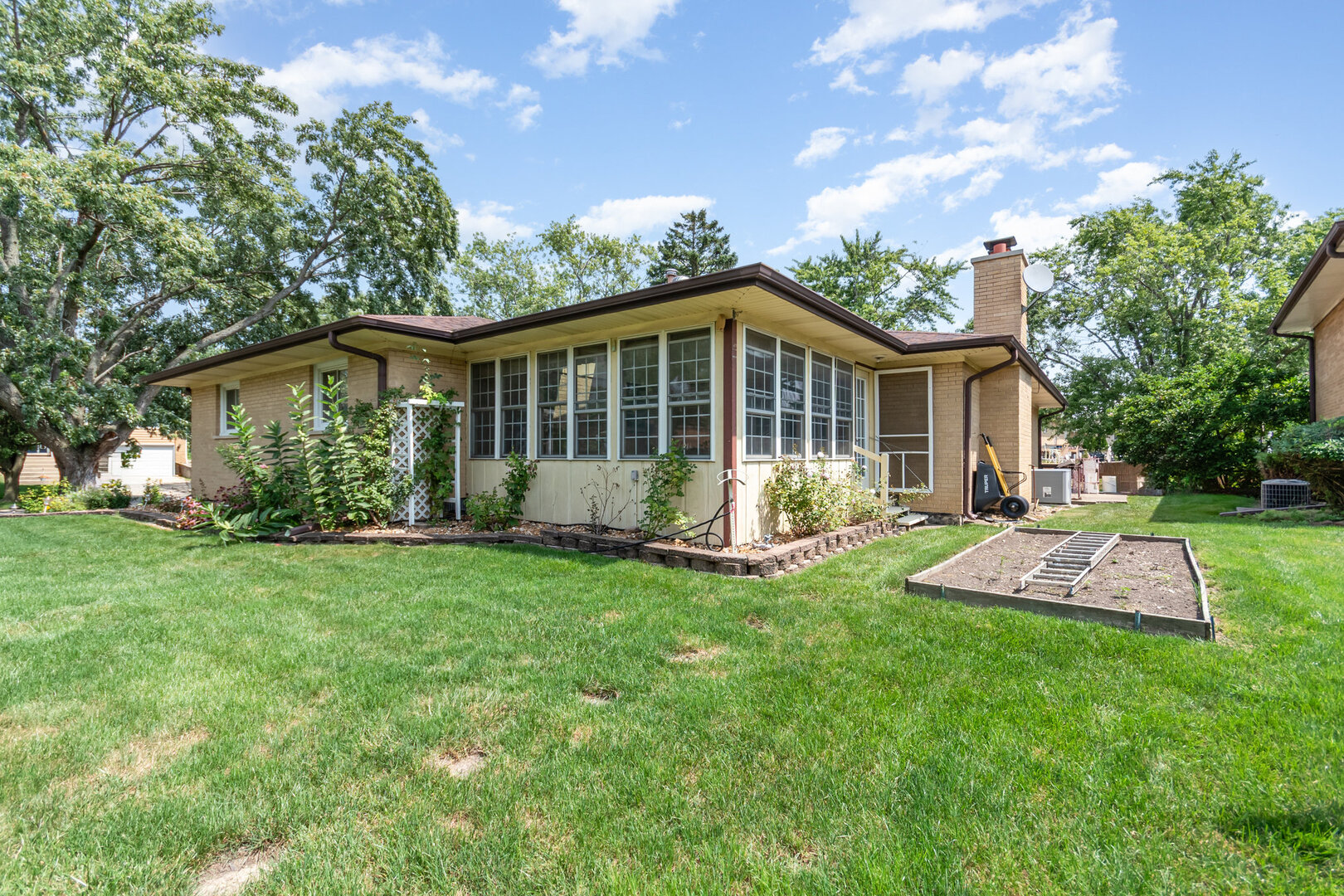 15200 Pine Drive Oak Forest, IL 60452 - Photo 20 of 20 a view of a house with a yard and porch