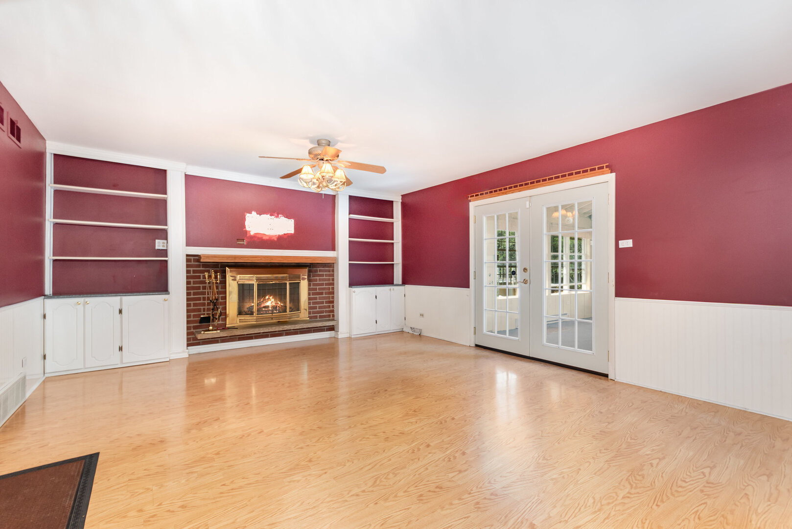 15200 Pine Drive Oak Forest, IL 60452 - Photo 9 of 20 a view of an empty room with a fireplace and a window