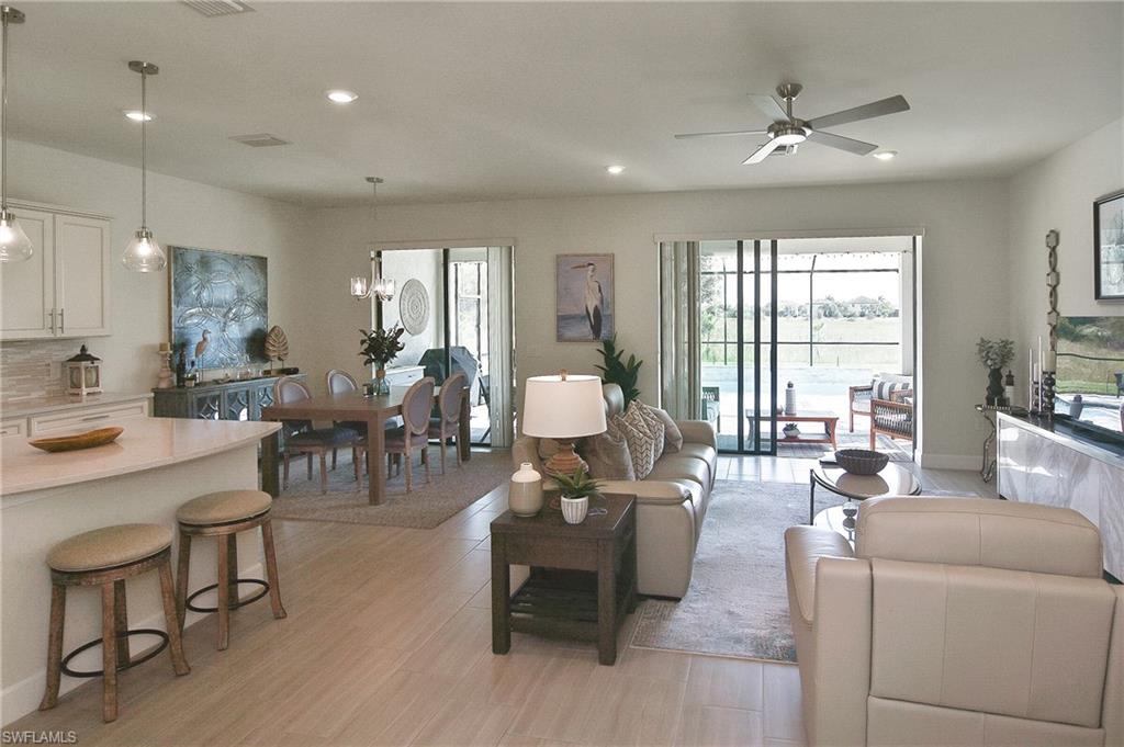 19375 Elston Way Estero, FL 33928 - Photo 16 of 50 a living room with furniture and large windows