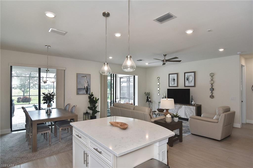 19375 Elston Way Estero, FL 33928 - Photo 50 of 50 a view of a dining room with furniture and a chandelier
