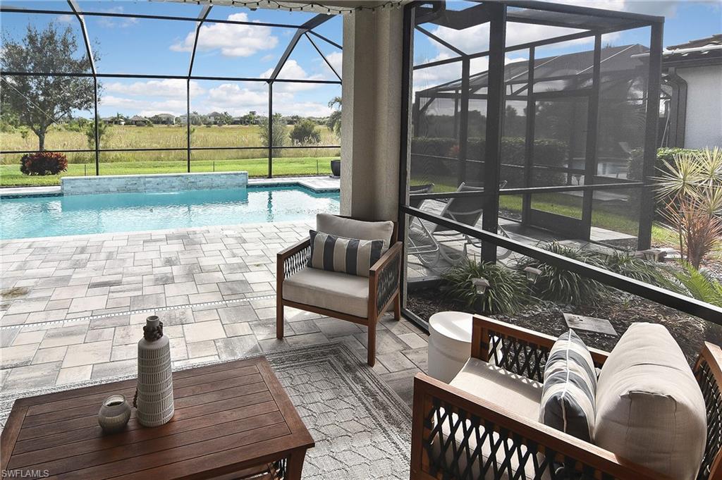 19375 Elston Way Estero, FL 33928 - Photo 38 of 50 a roof deck with table and chairs