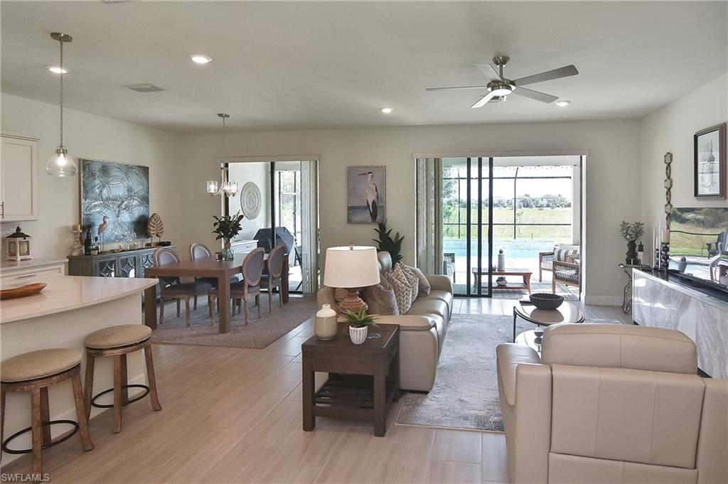 19375 Elston Way Estero, FL 33928 - Photo 10 of 50 a living room with furniture and large windows