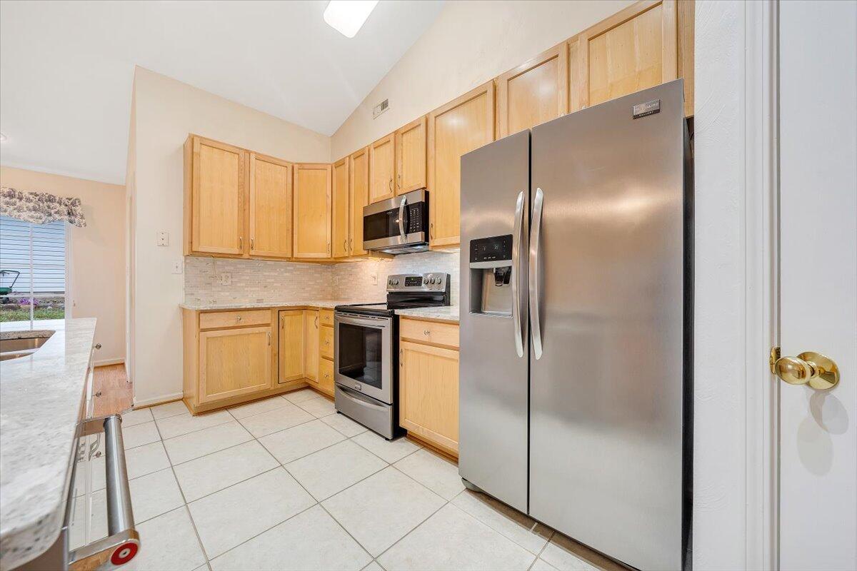 4202 Daugherty Road Salem, VA 24153 - Photo 12 of 38 a kitchen with a refrigerator sink and cabinets