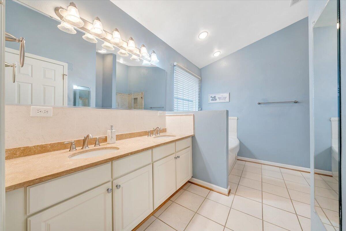 4202 Daugherty Road Salem, VA 24153 - Photo 18 of 38 a bathroom with a double vanity sink and a mirror