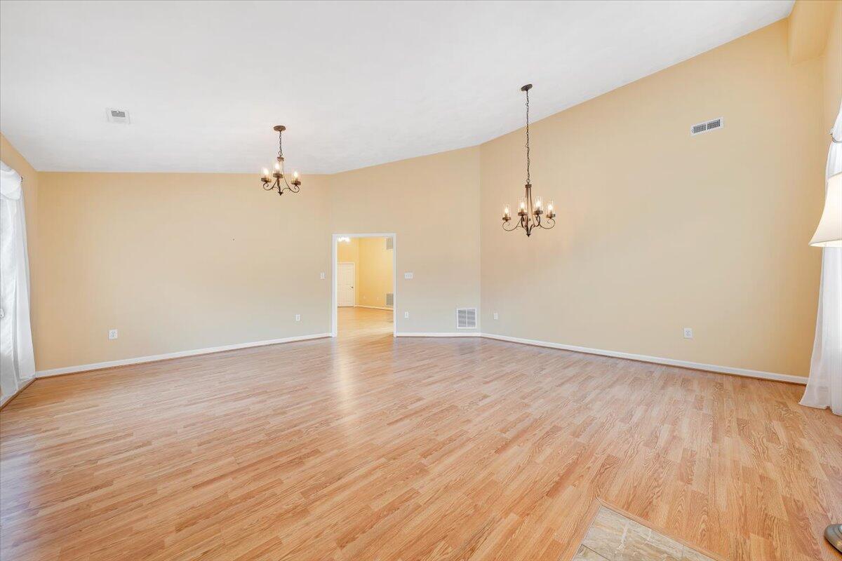 4202 Daugherty Road Salem, VA 24153 - Photo 2 of 38 a view of a room with wooden floor and ceiling fan