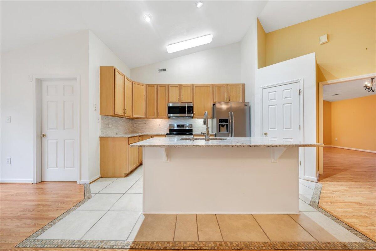 4202 Daugherty Road Salem, VA 24153 - Photo 26 of 38 a kitchen with stainless steel appliances granite countertop a stove a sink and a refrigerator