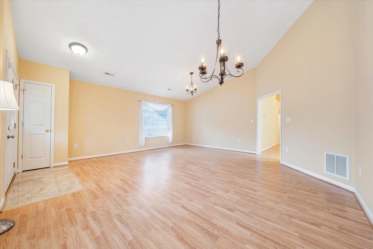 4202 Daugherty Road Salem, VA 24153 - Photo 3 of 38 a view of a room with wooden floor and ceiling fan