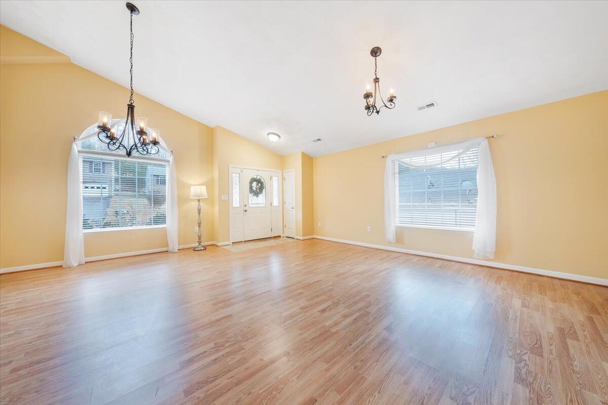 4202 Daugherty Road Salem, VA 24153 - Photo 5 of 38 a view of a room with wooden floor chandelier and windows
