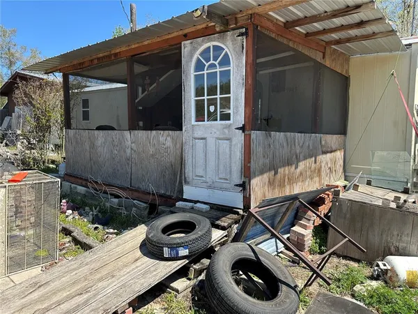a view of a car park in front of a house