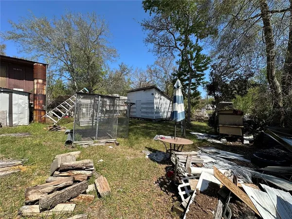 a view of a backyard with sitting area
