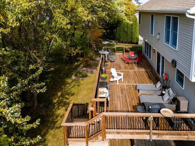 an empty room with wooden floor and a window