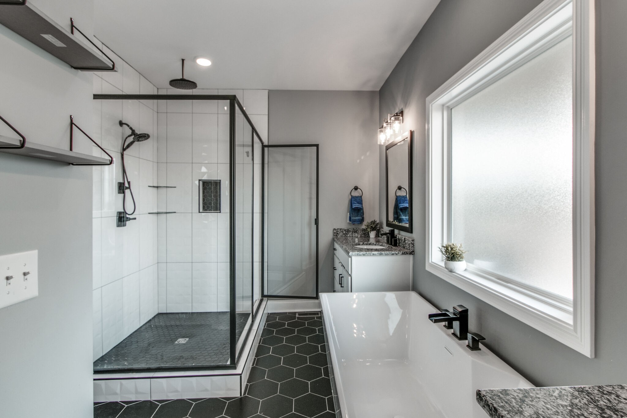 1940 Hickory Point Road Clarksville, TN 37043 - Photo 26 of 48 a bathroom with a tub and a glass door shower