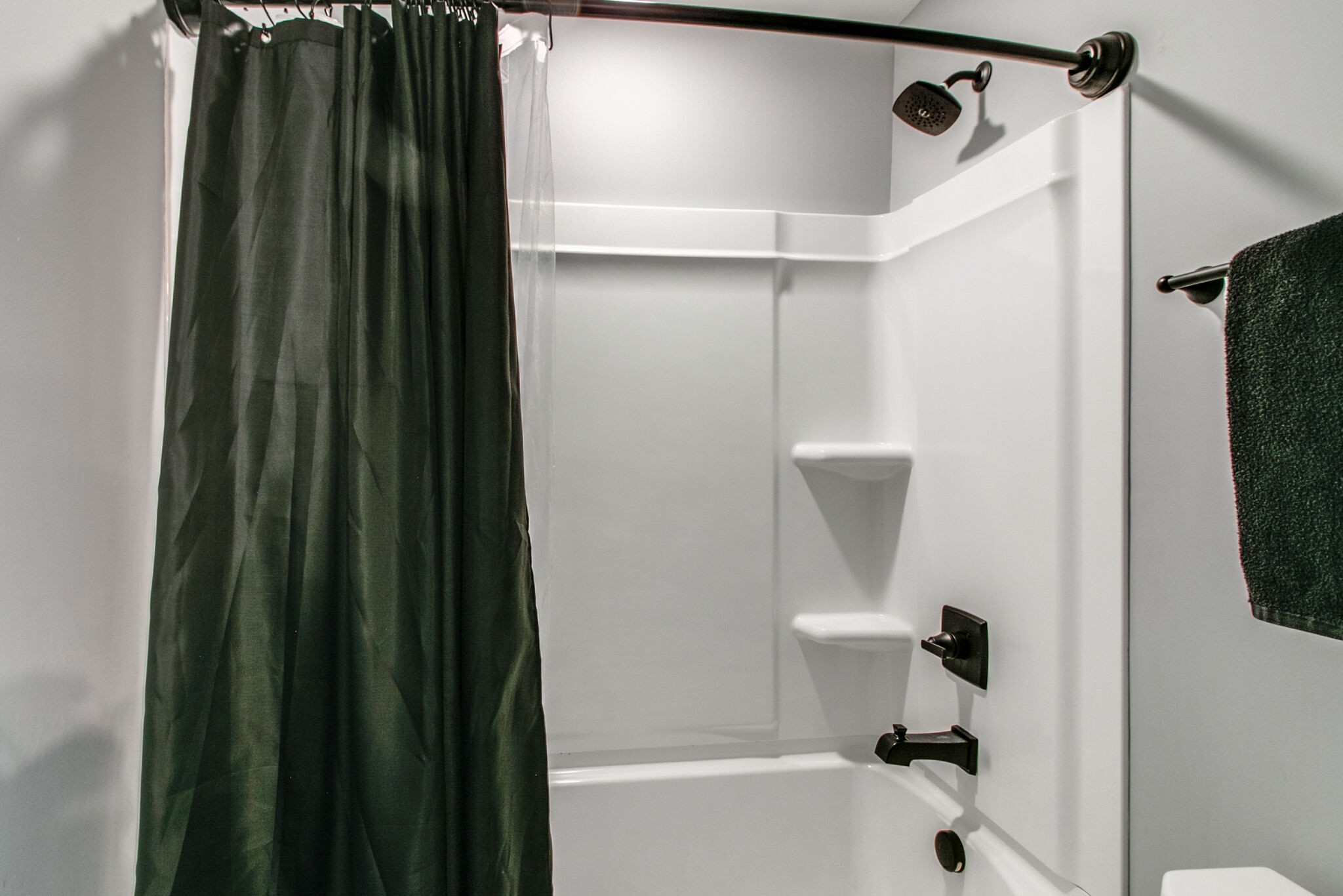 1940 Hickory Point Road Clarksville, TN 37043 - Photo 32 of 48 a bathroom with a bathtub and a shower