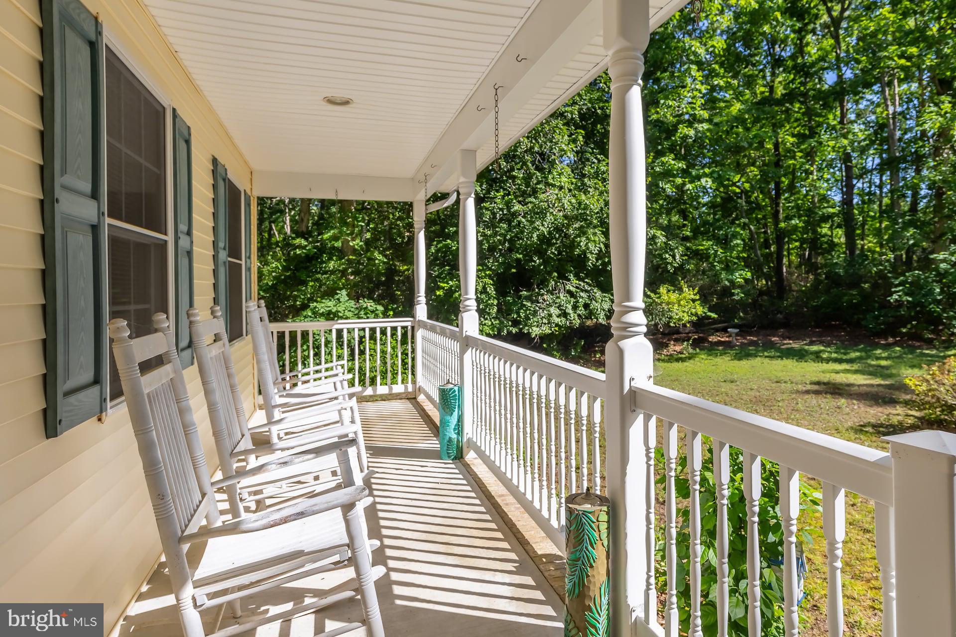 164 Clarks Pond Road Bridgeton, NJ 08302 - Photo 2 of 27 Charming porch with serene views.