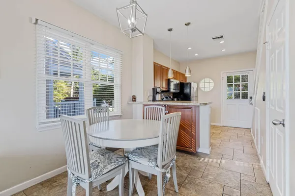 a dining room with furniture and window