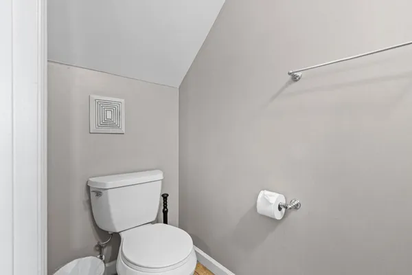 a white toilet sitting next to a bathroom sink