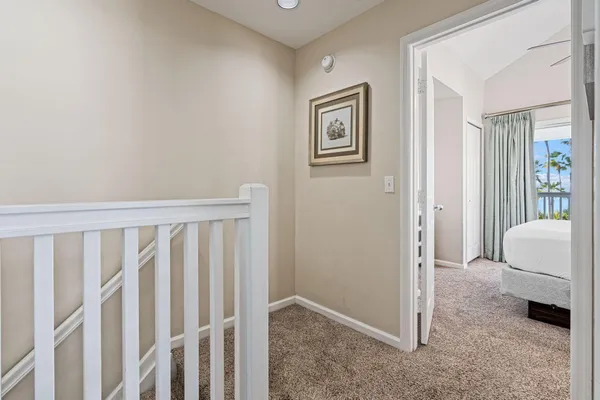 a view of room with window and a ceiling fan