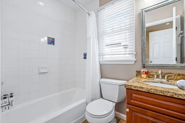 a view of a porch with wooden floor
