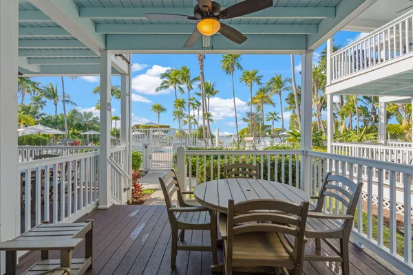 a view of a backyard with a garden and swimming pool