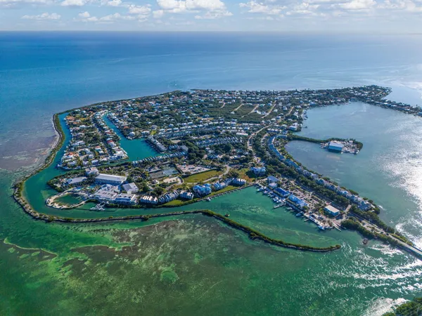 an aerial view of a house with a lake view