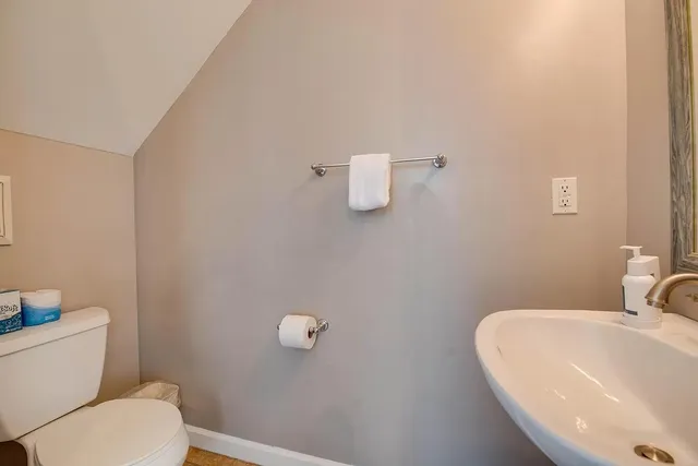 a bathroom with a toilet and a sink