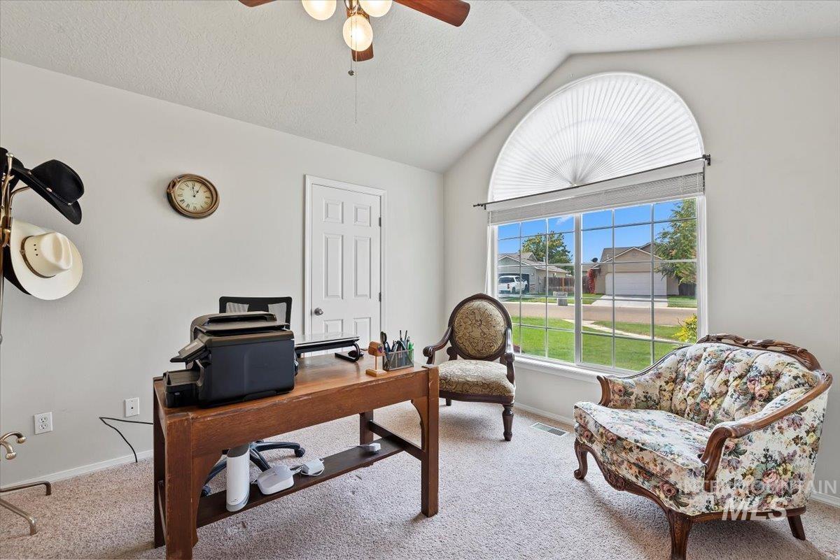 16608 Old Friendship Way Caldwell, ID 83607 - Photo 13 of 32 Home office with lofted ceiling, carpet floors, a textured ceiling, and ceiling fan