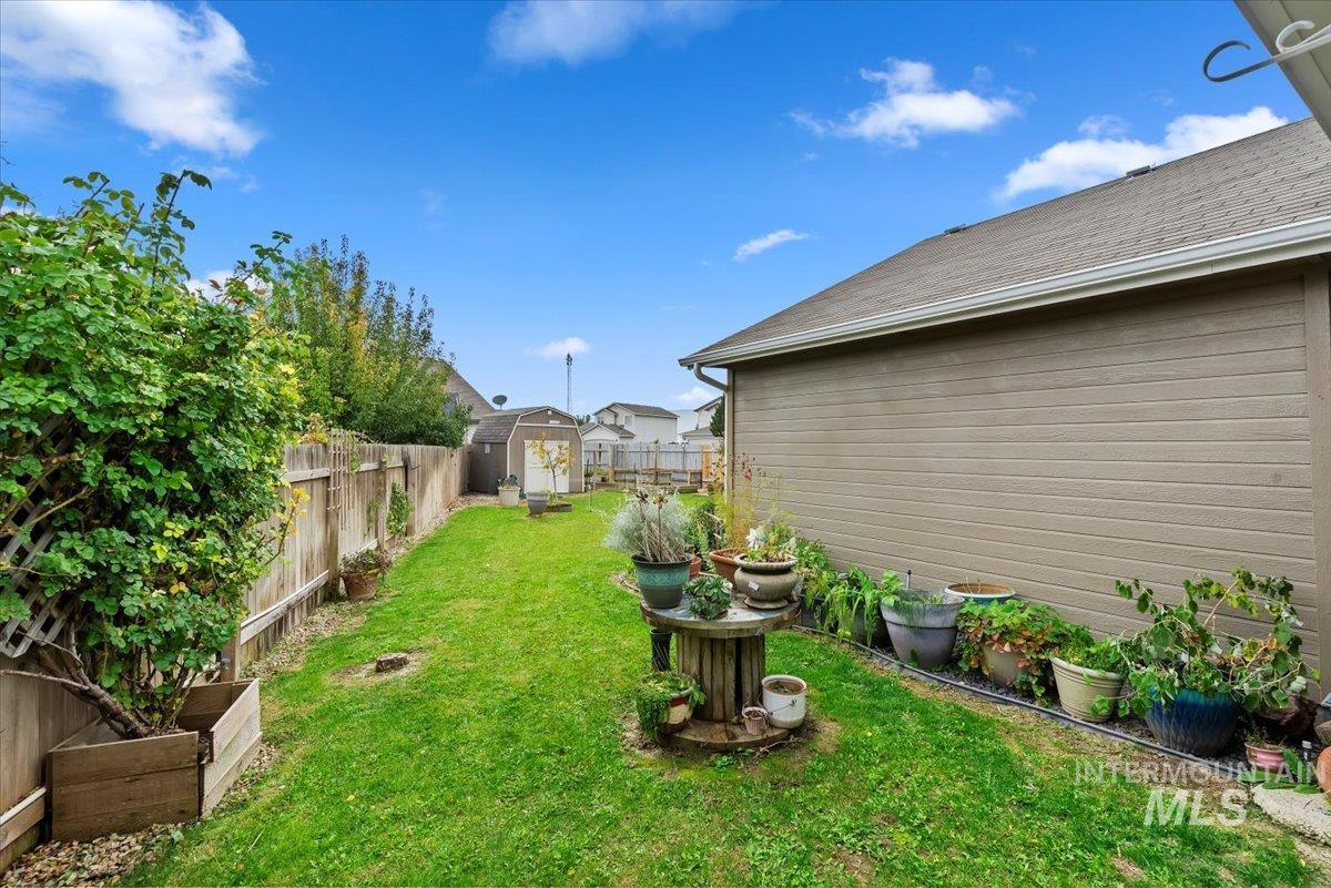 16608 Old Friendship Way Caldwell, ID 83607 - Photo 27 of 32 Fenced backyard with a storage shed