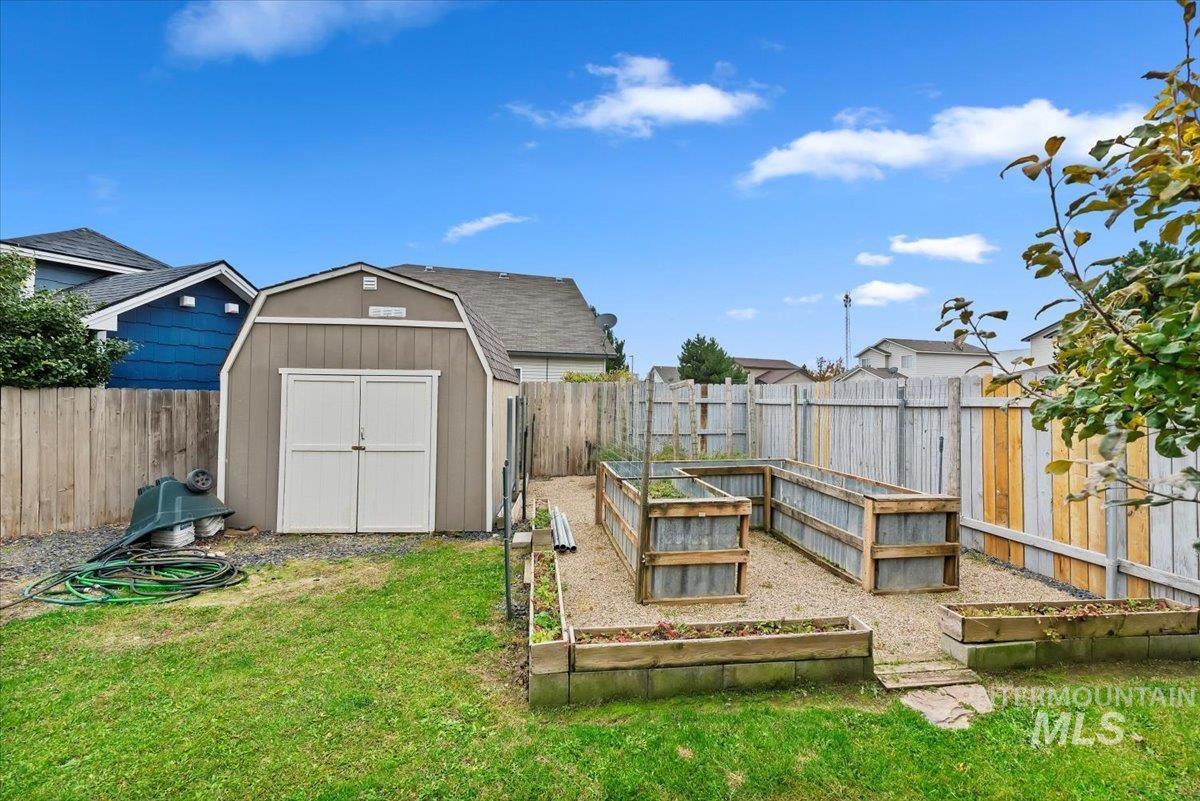 16608 Old Friendship Way Caldwell, ID 83607 - Photo 28 of 32 View of shed featuring a vegetable garden and a fenced backyard