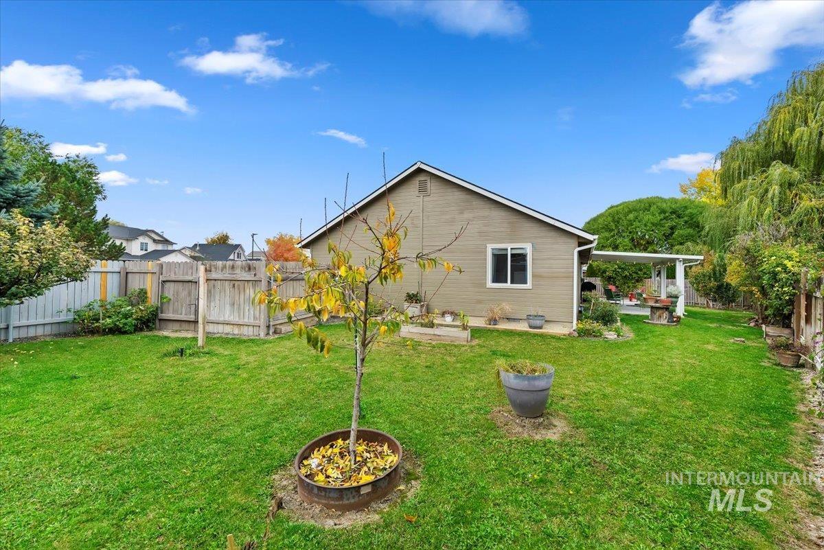 16608 Old Friendship Way Caldwell, ID 83607 - Photo 29 of 32 Back of house featuring a fenced backyard and a patio area