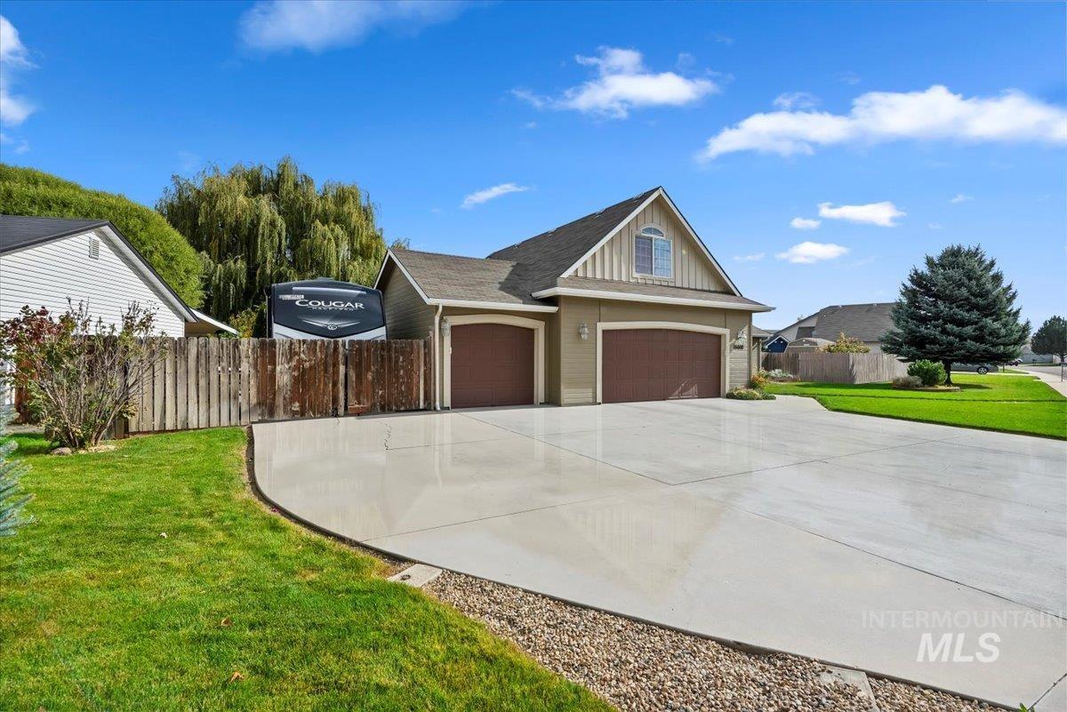 16608 Old Friendship Way Caldwell, ID 83607 - Photo 4 of 32 View of front of home with concrete driveway, board and batten siding, and roof with shingles