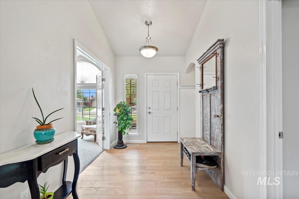 16608 Old Friendship Way Caldwell, ID 83607 - Photo 5 of 32 Entryway with light wood-type flooring and a textured ceiling