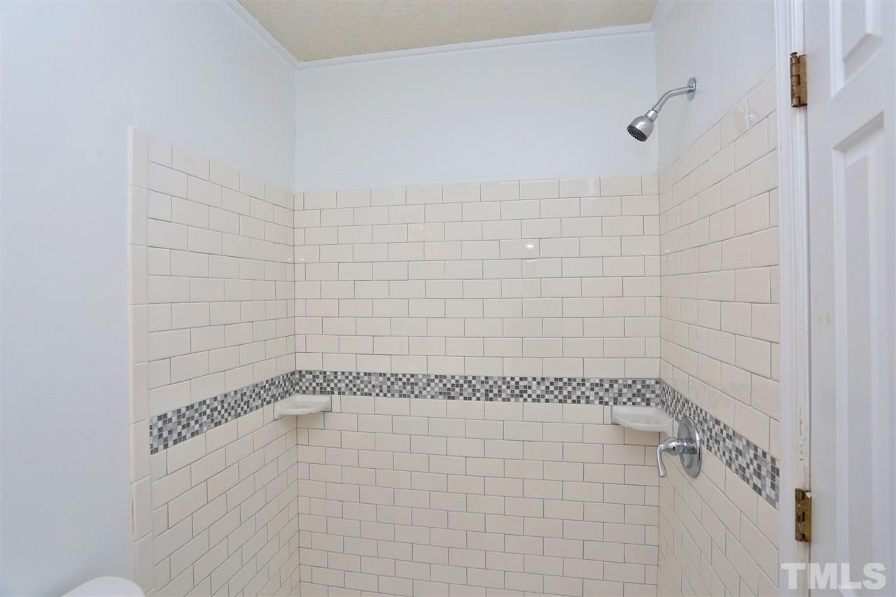 4465 Roller Court Raleigh, NC 27604 - Photo 13 of 23 a bathroom with a shower