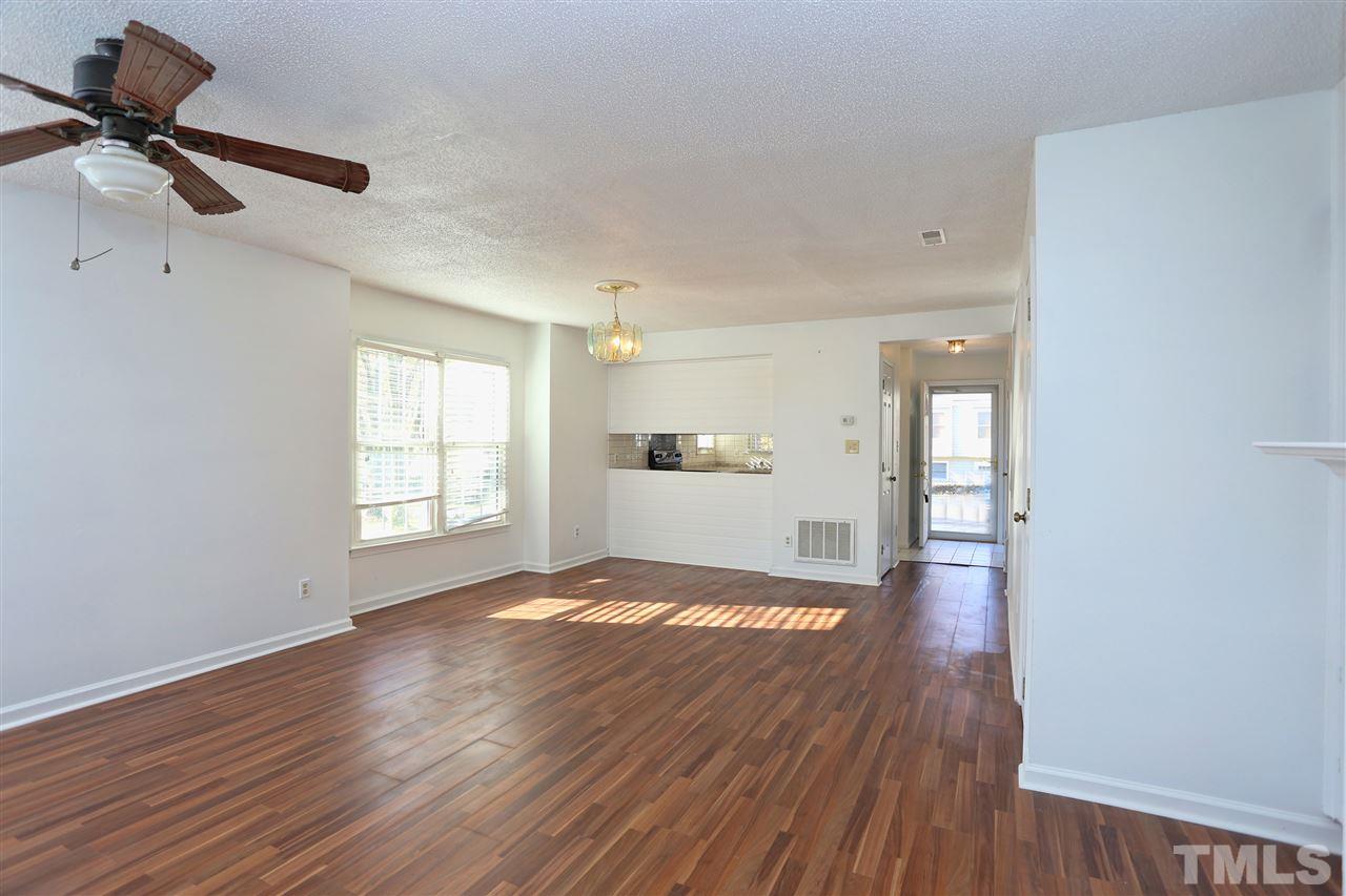4465 Roller Court Raleigh, NC 27604 - Photo 3 of 23 a view of empty room with wooden floor and fan