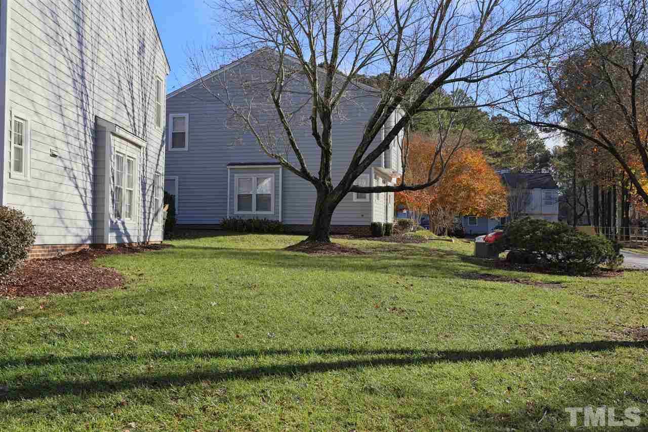 4465 Roller Court Raleigh, NC 27604 - Photo 22 of 23 a view of a backyard with large trees