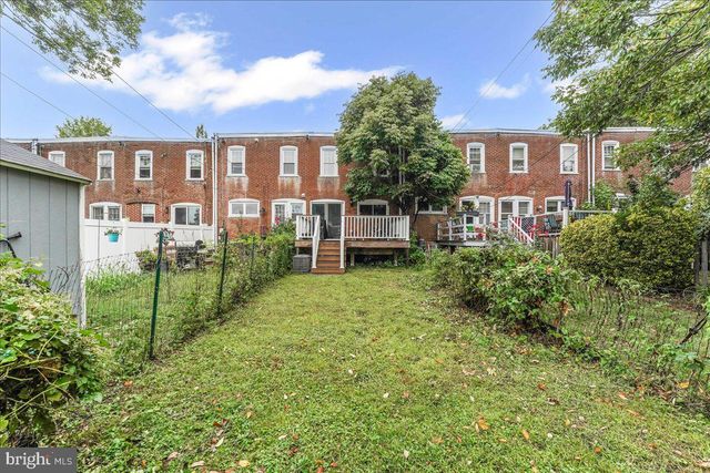 a view of a house with a yard and plants