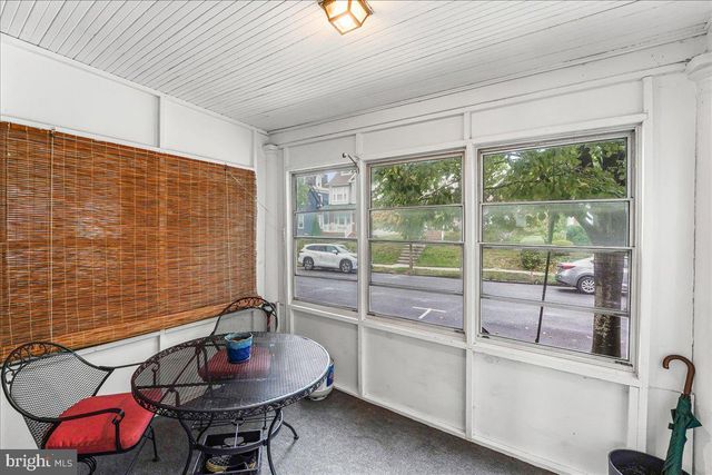 a room with furniture and a potted plant