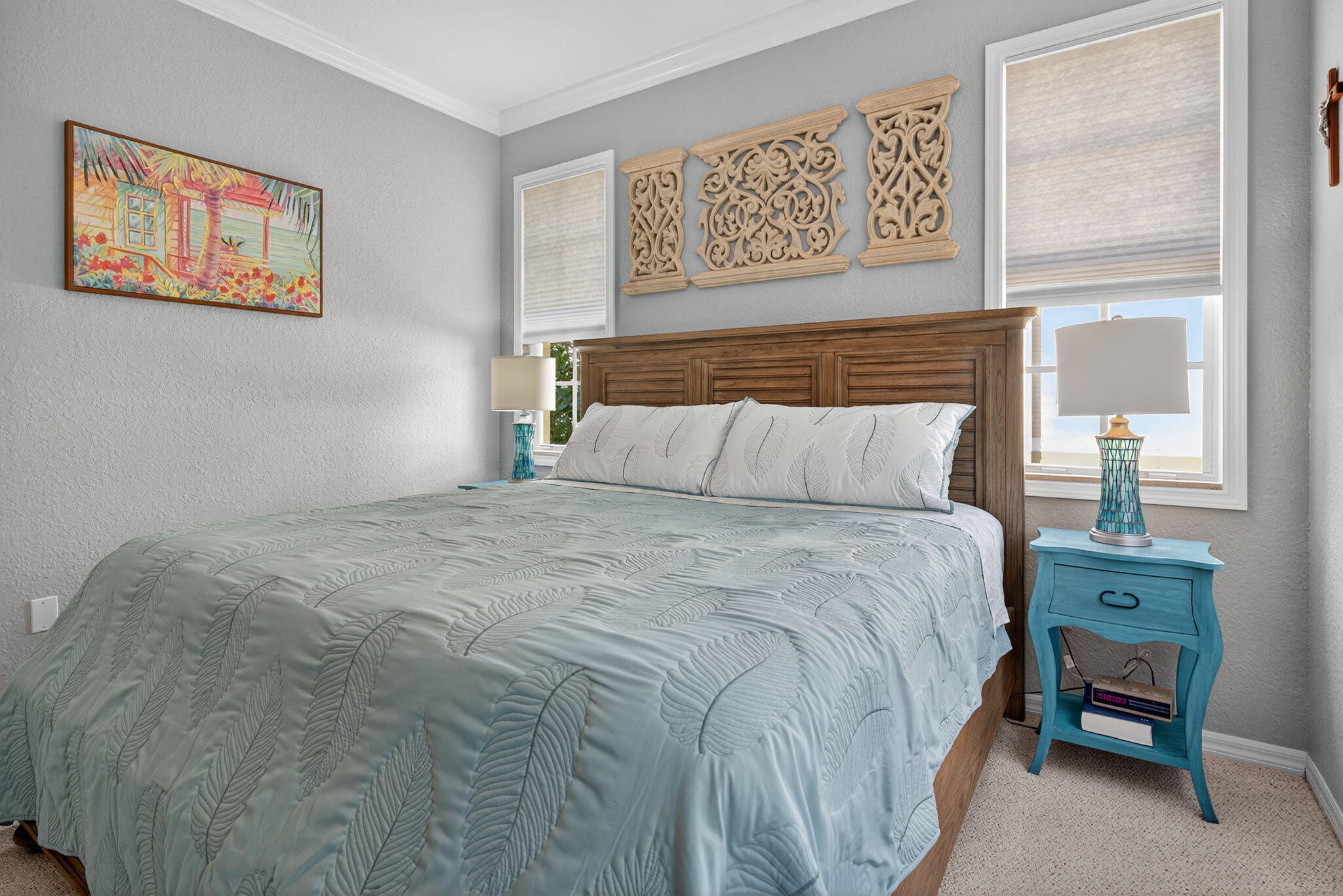 141 Seagrape Drive, Unit 203 Jupiter, FL 33458 - Photo 18 of 39 a bedroom with a bed and painting on the wall