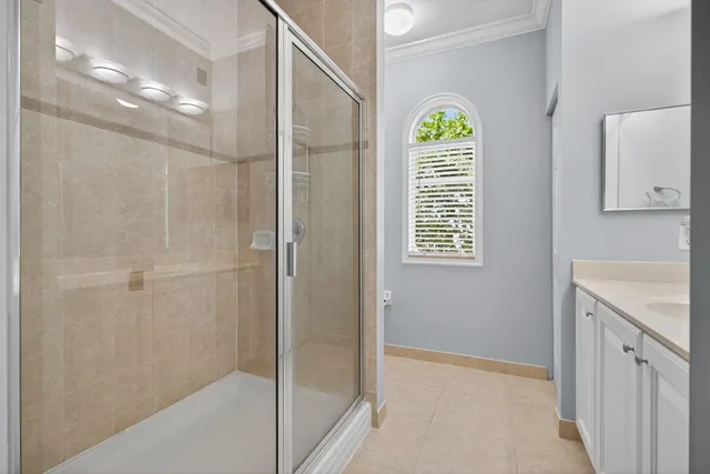 a bathroom with a sink a vanity a mirror and a bathtub